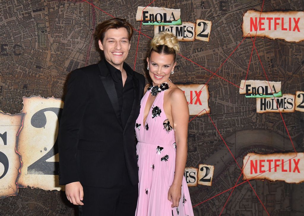 Jake Bongiovi (L) and British actress Millie Bobby Brown arrive for the premiere of Netflix's "Enola Holmes 2" at The Paris Theatre in New York City on October 27, 2022.