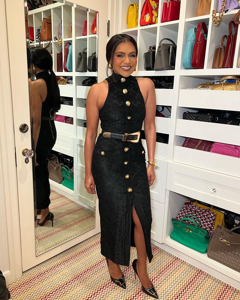 mindy kaling wearing black dress standing inside closet