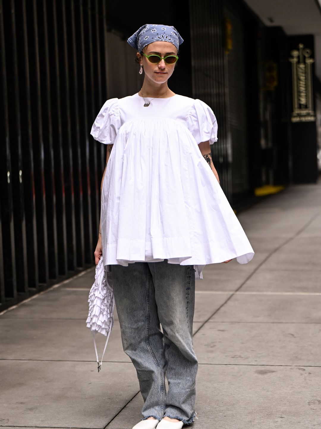 Ella Emhoff is seen wearing a white top, faded jeans, white shoes, white bag and blue headhand outside the Sandy Liang show during NYFW F/W 2025 on February 09, 2025 in New York City