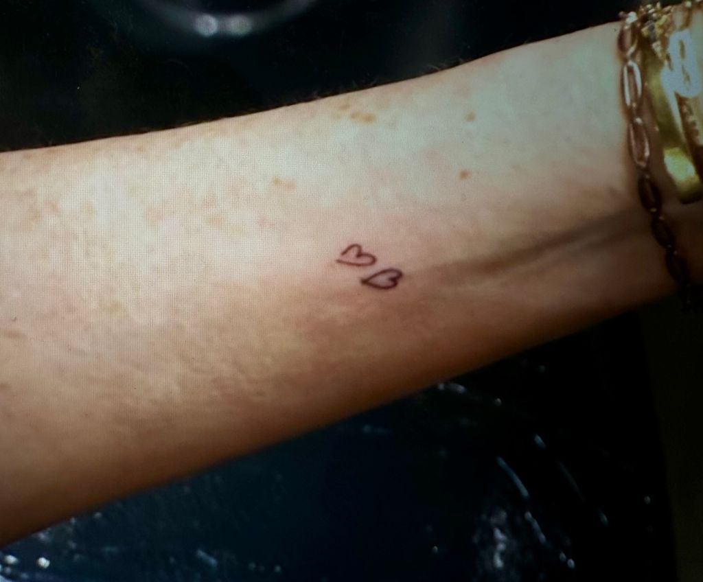 Still from The Drew Barrymore Show March 11 2025 of Savannah Guthrie's new heart tattoo she got in honor of her kids on the show