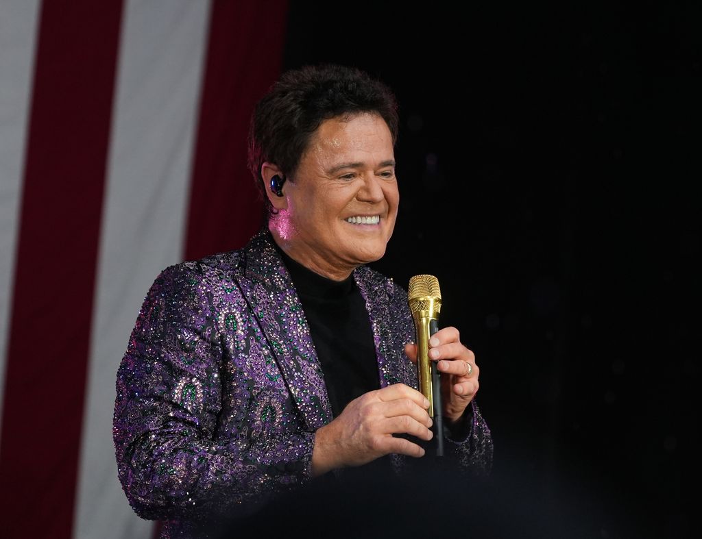 Donny Osmond smiling on stage in New York City at Fox & Friends All-American Summer Concert Series at Fox News Channel Studios on July 12, 2024