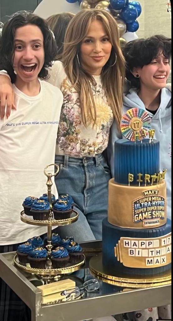 Jennifer Lopez poses with her twins Max and Emme alongside Max's birthday cakes in a photo shared on Instagram