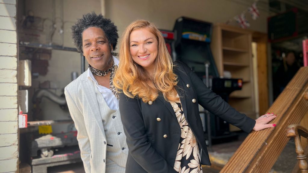 Man and woman smiling for camera