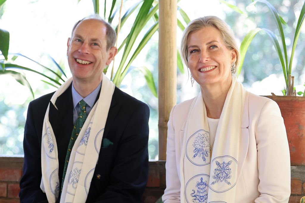 Edward and Sophie wearing white scarves in Nepal