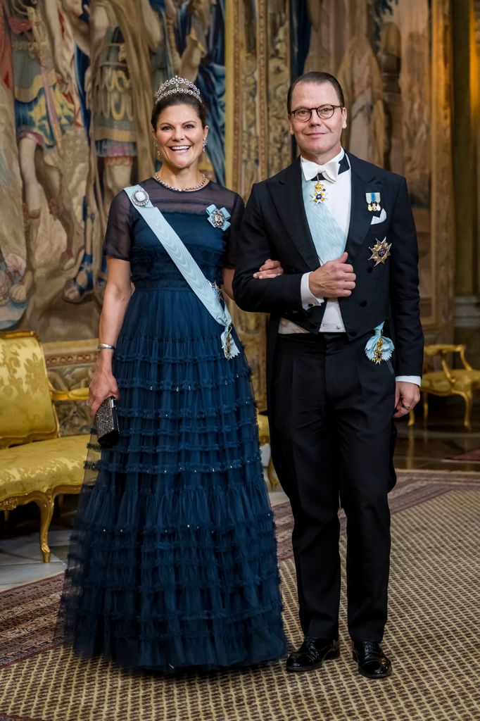 Crown Princess Victoria in navy gown and tiara with Prince Daniel 