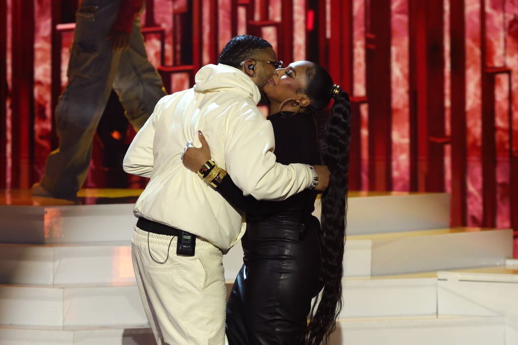 Nelly and Ashanti hug onstage at the 2025 iHeartRadio Music Awards at Dolby Theatre in Los Angeles, California on March 17, 2025. Broadcasted live on FOX