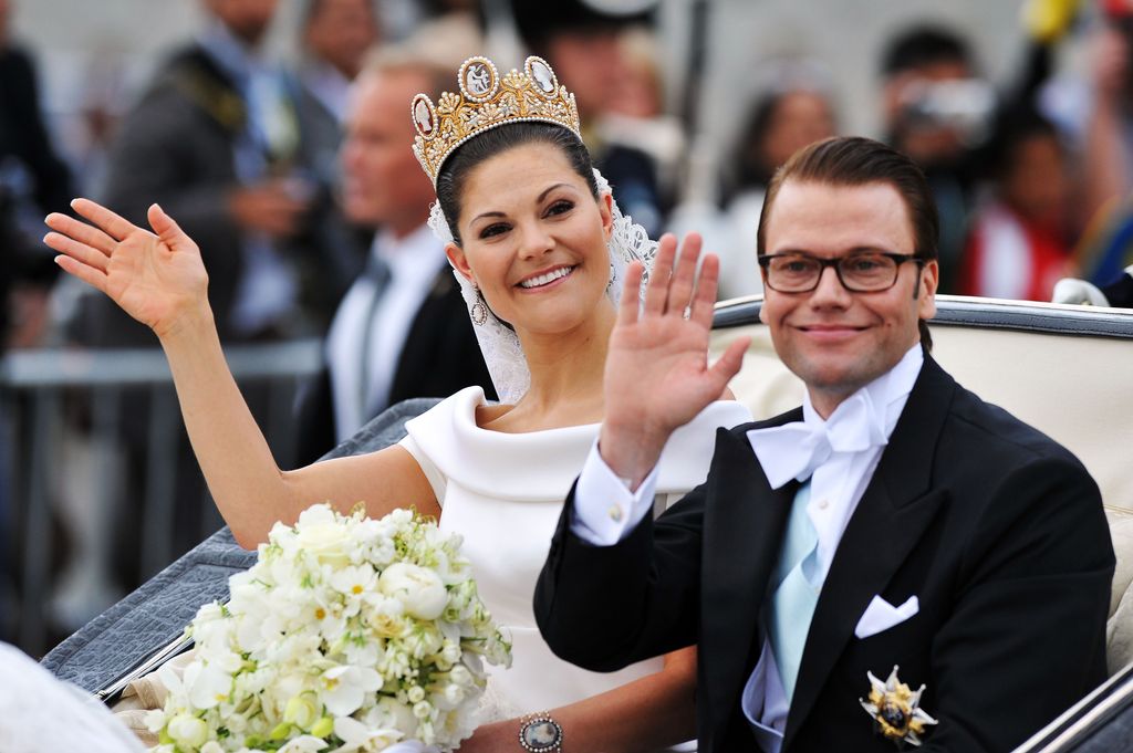 Crown Princess Victoria and prince daniel in carriage waving