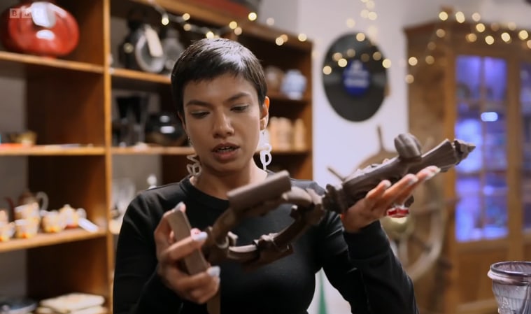 Woman holding wooden antique