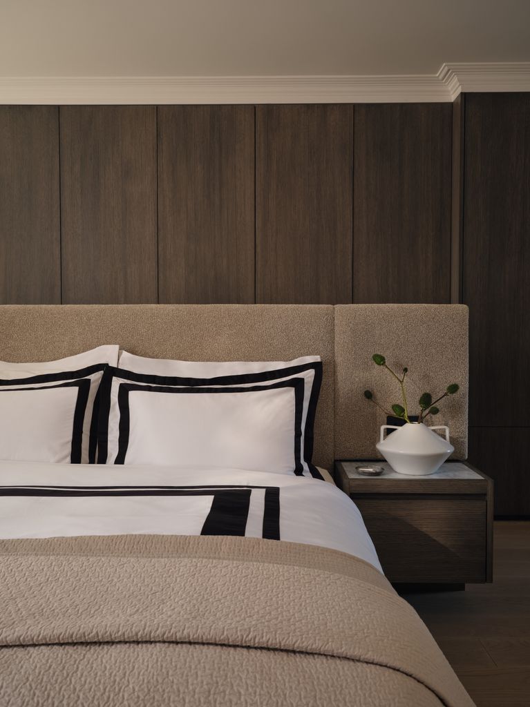 bedroom-with-dark-brown-walls-and-large-bed