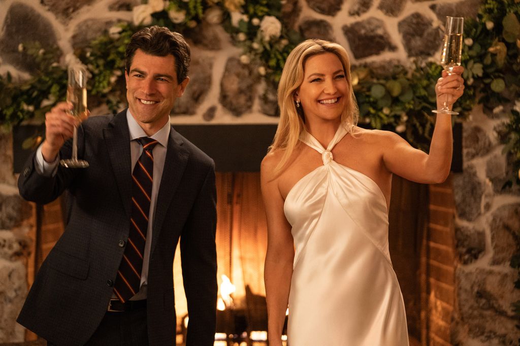 Max Greenfield as Lev Levinson and Kate Hudson as Isla Gordon