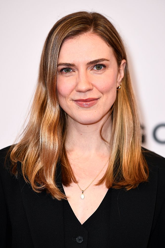 Sara Canning wearing a black V-neck top