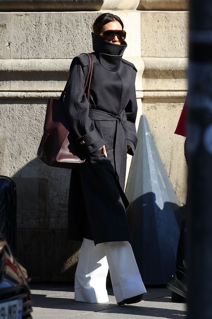 Victoria Beckham in a black collared coat