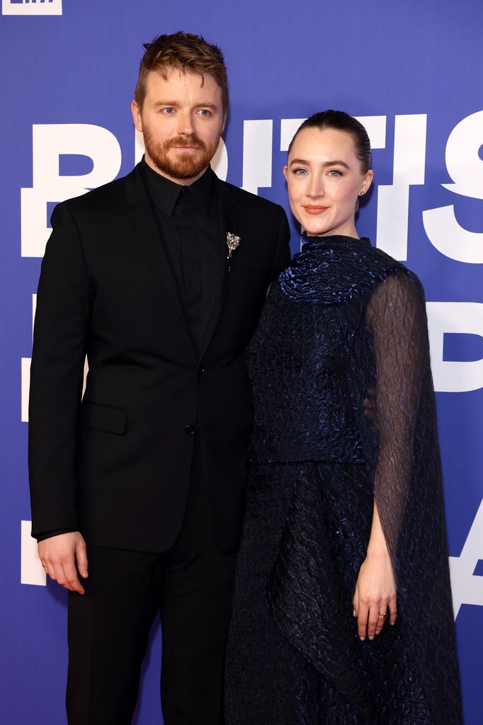 couple posing for photo at event 