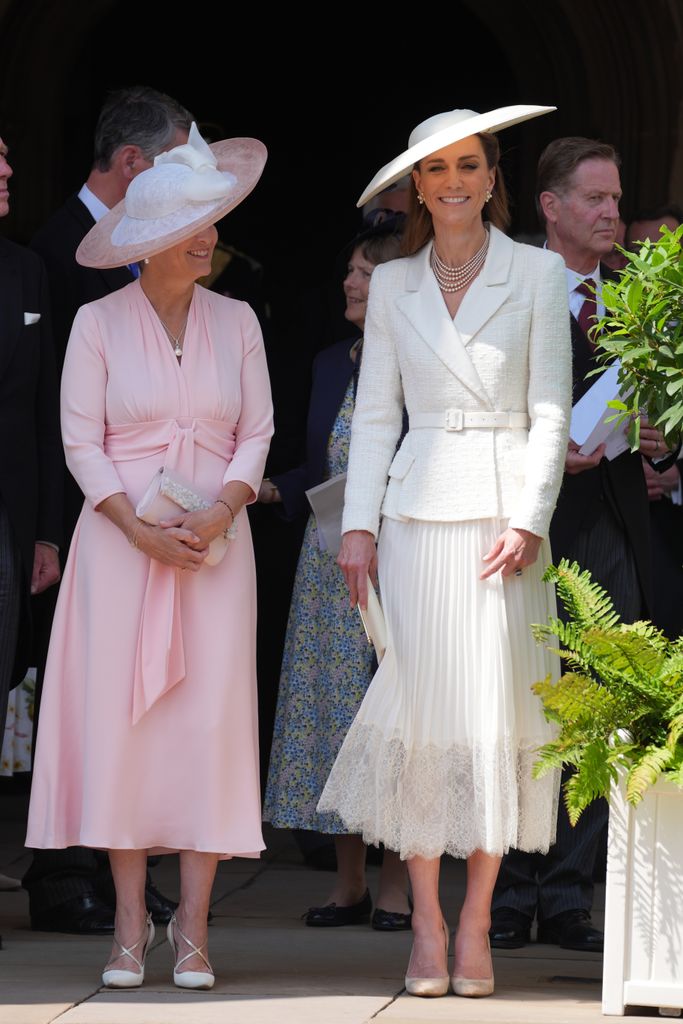 Sophie, Duchess of Edinburgh in pink dress beside Catherine, Princess of Wales in white dress