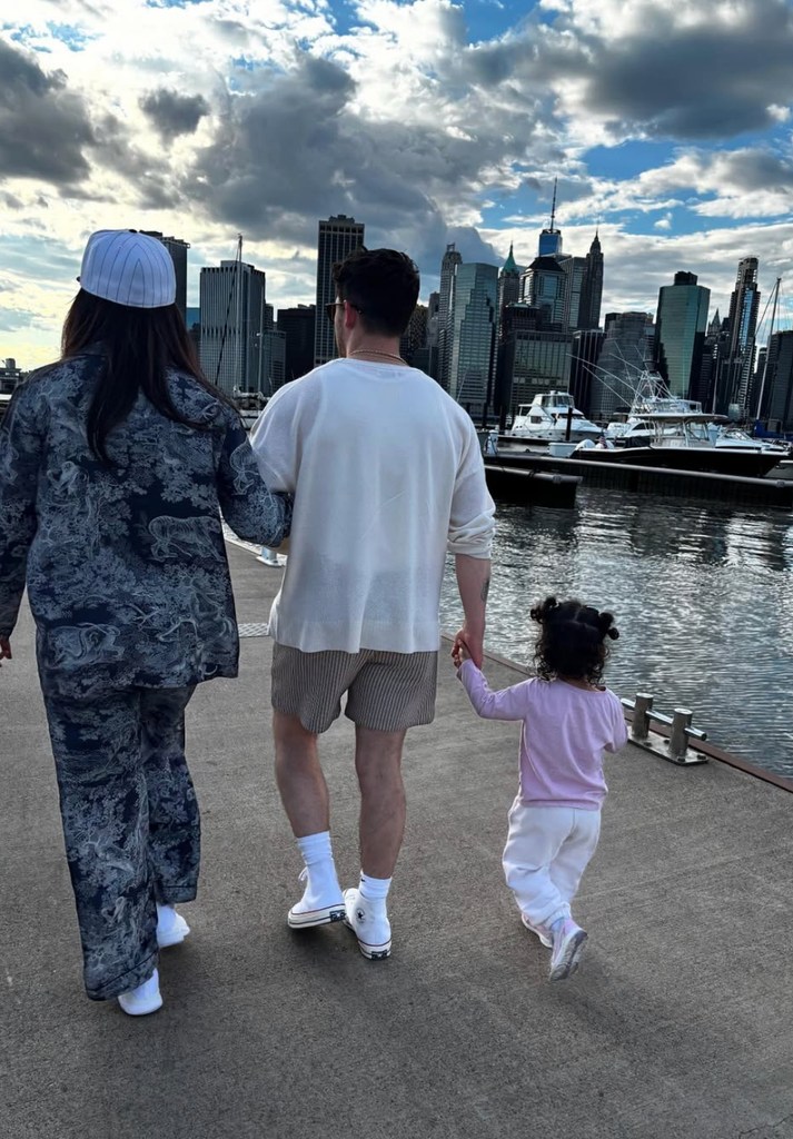Photo shared by Priyanka Chopra featuring her husband Nick Jonas and daughter Malti walking around New York City