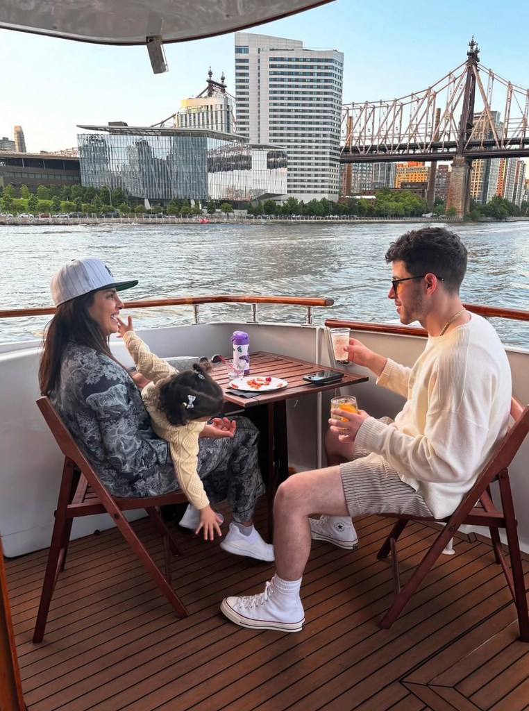 Photo shared by Priyanka Chopra featuring her husband Nick Jonas and daughter Malti on a boat around New York City