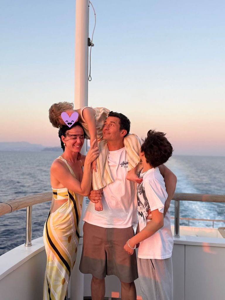 Orlando Bloom and Katy Perry pose for a photo with their kids Daisy and Flynn on a yacht, shared on Instagram