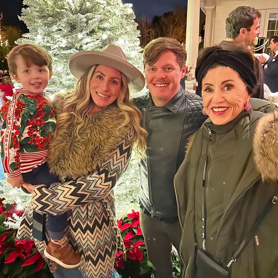 Kami Brooke Hudson, David Hudson, their son Legend, and Mary Hudson pose for a photo in front of a Christmas tree at a lighting ceremony, shared on Instagram