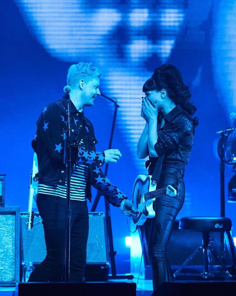 photo of jack white and wife olivia jean on stage mid engagement