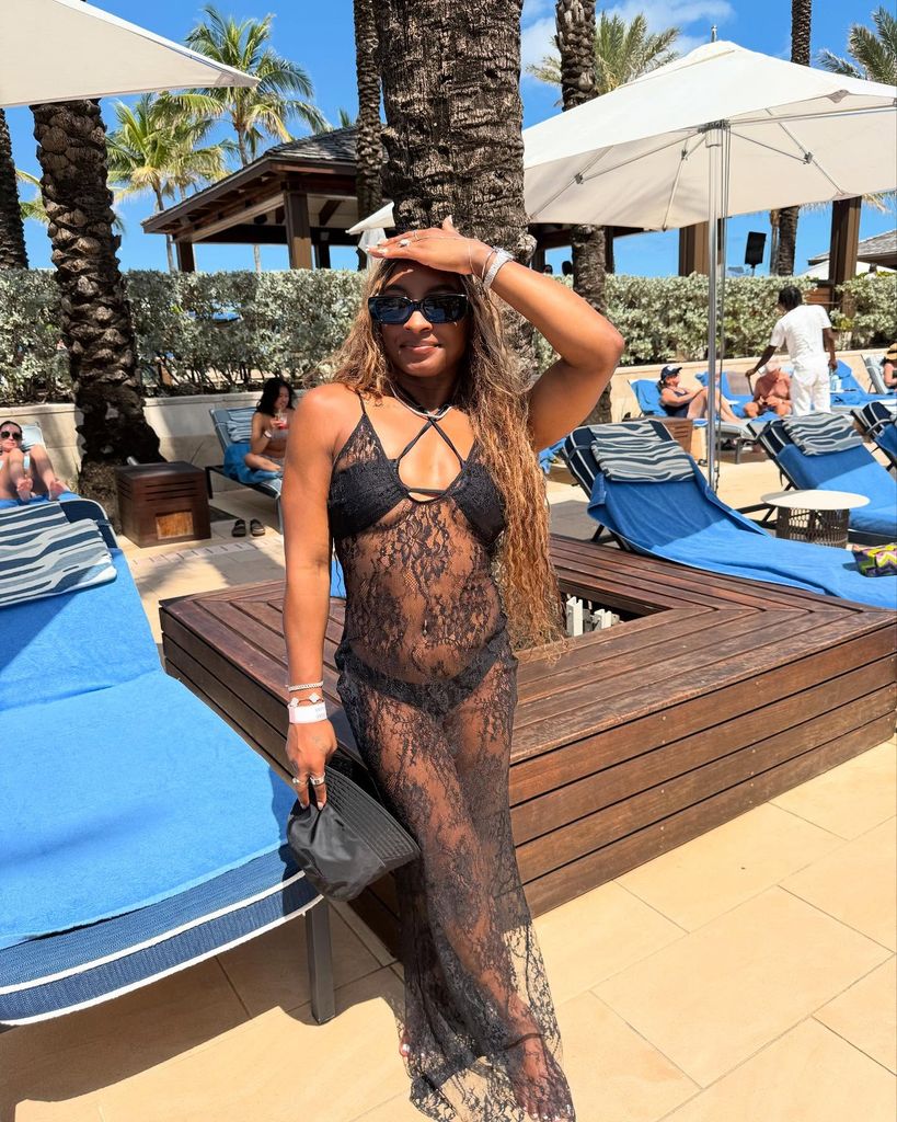 simone biles in black bikini with lace dress cover up