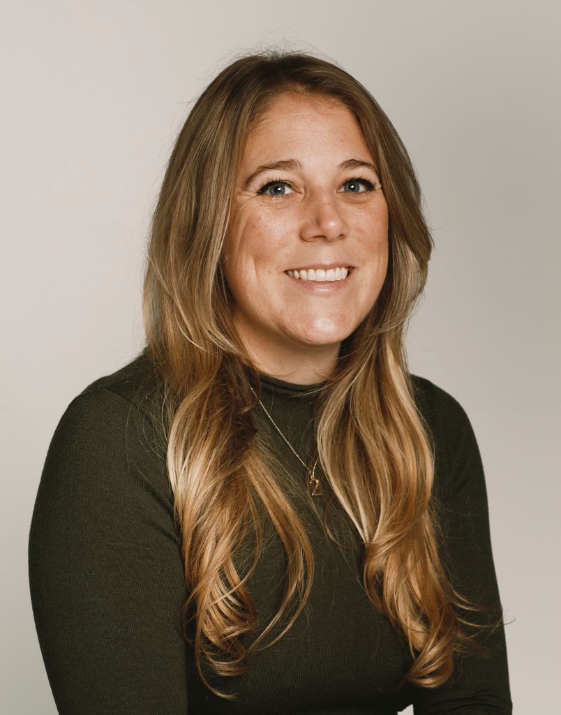 Smiling woman with long blonde hair 