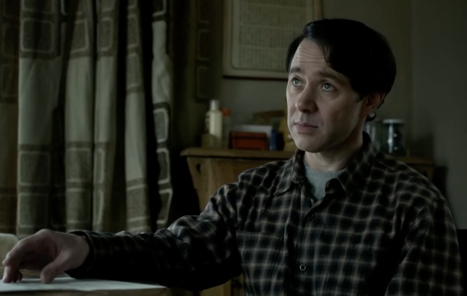 man sitting at table