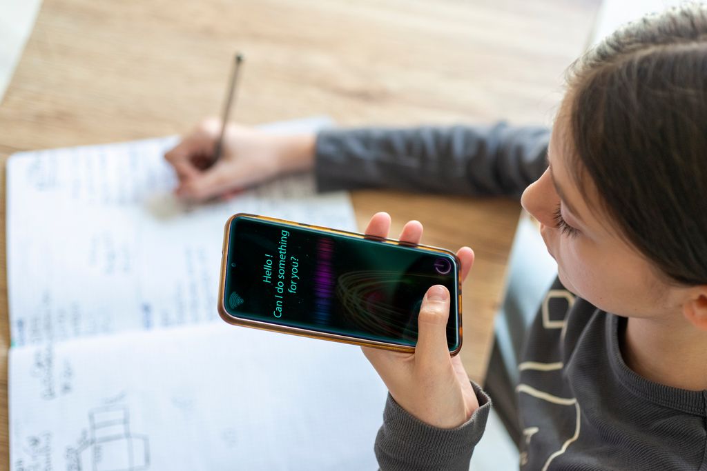 young girl using chatbot on mobile smartphone