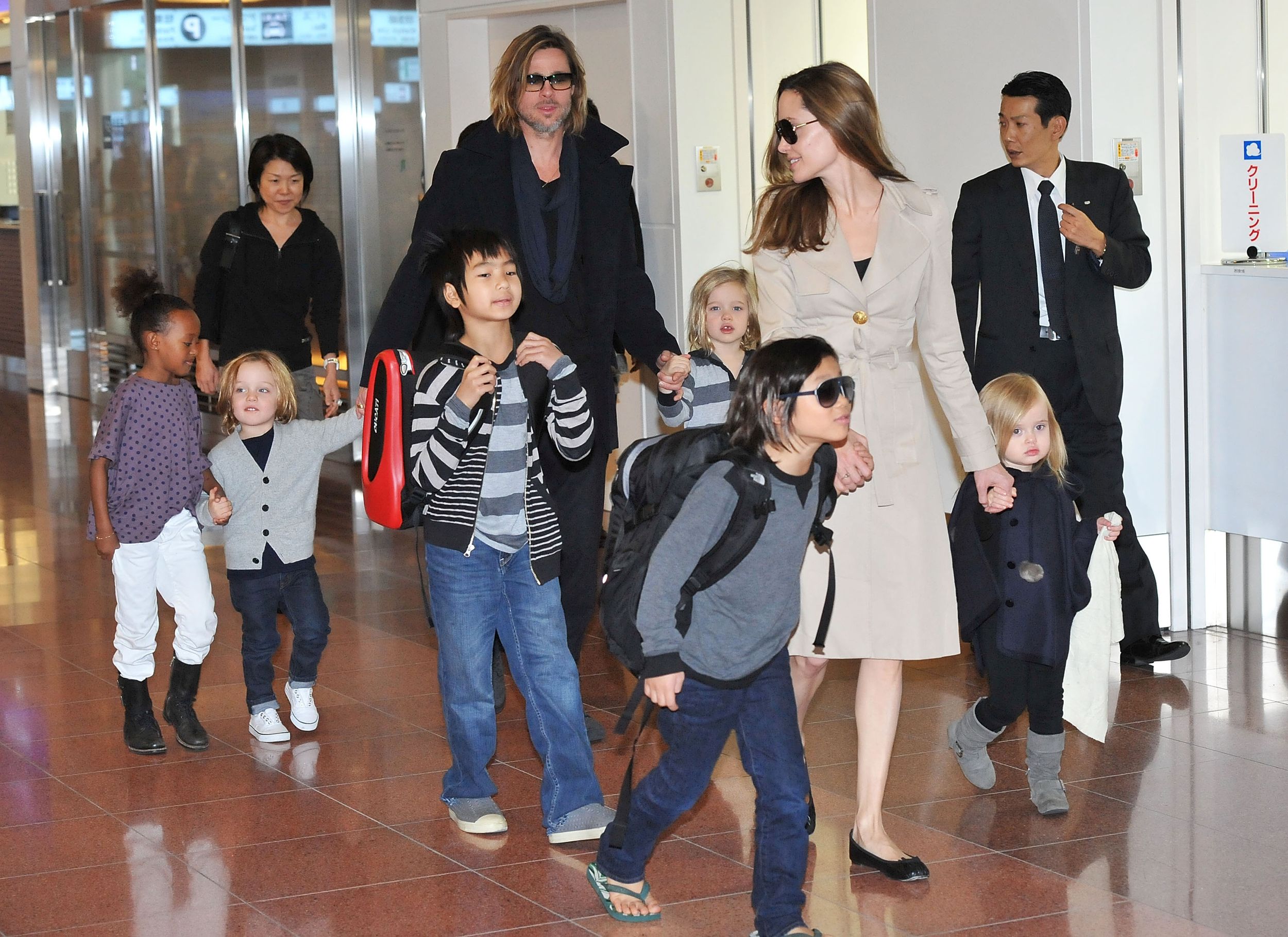 Brad Pitt, Angelina Jolie and their six children Maddox, Pax, Zahara, Shiloh, Knox, and Vivienne arrive  at Haneda International Airport 