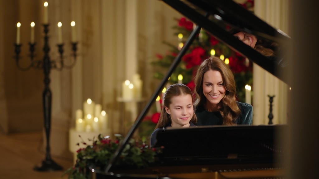 Princess Charlotte and Kate Middleton sitting at a piano