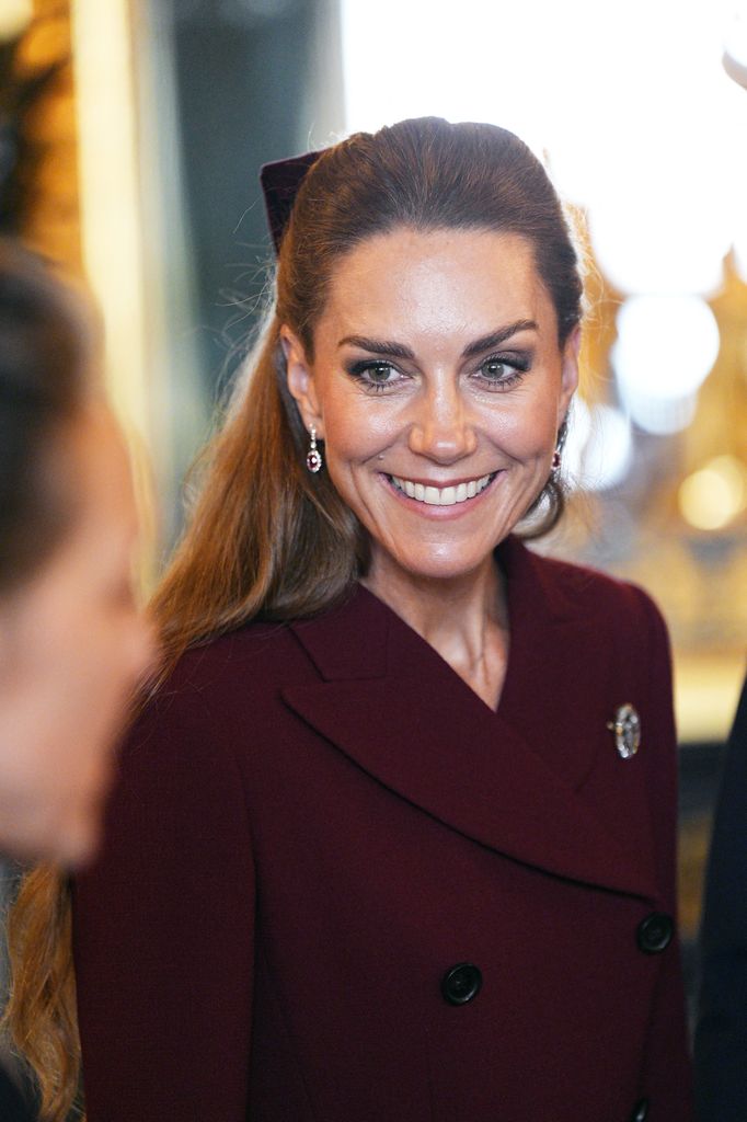 The Princess of Wales smiles as she views items from the Royal Collection in the Green Drawing Room at Windsor Castle