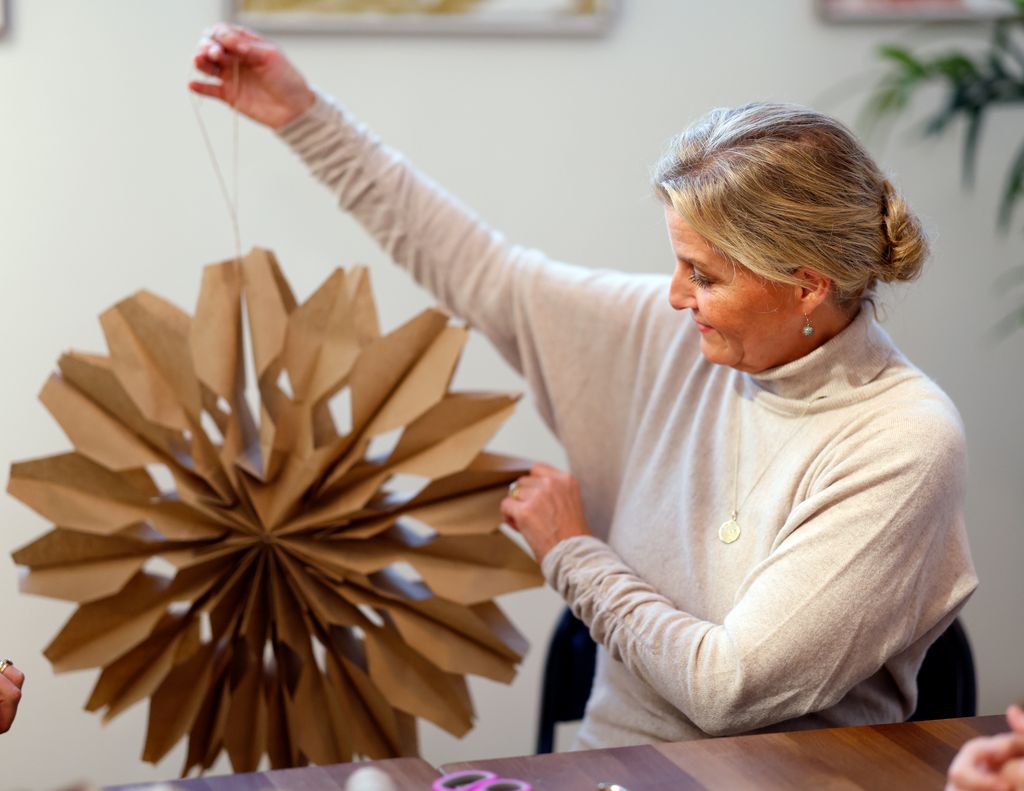 Sophie helped to make a giant paper snowflake decoration
