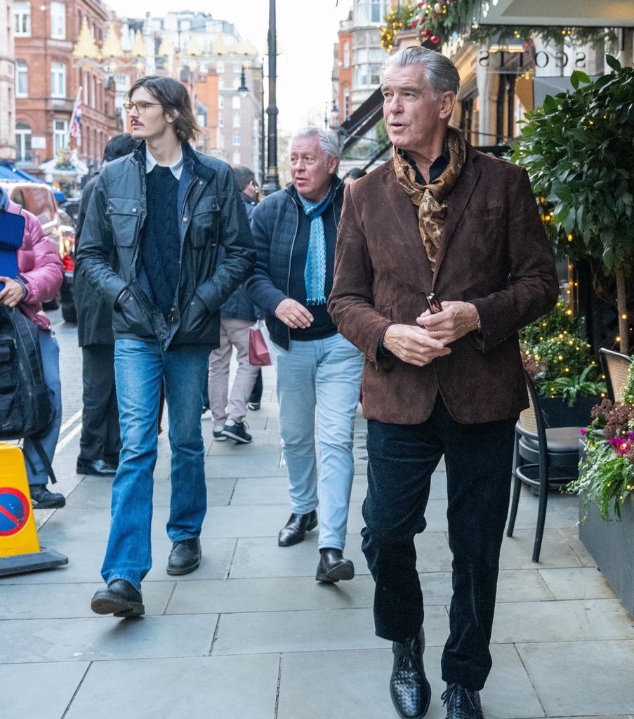 Pierce Brosnan in brown blazer and Dylan in jeans and leather jacket