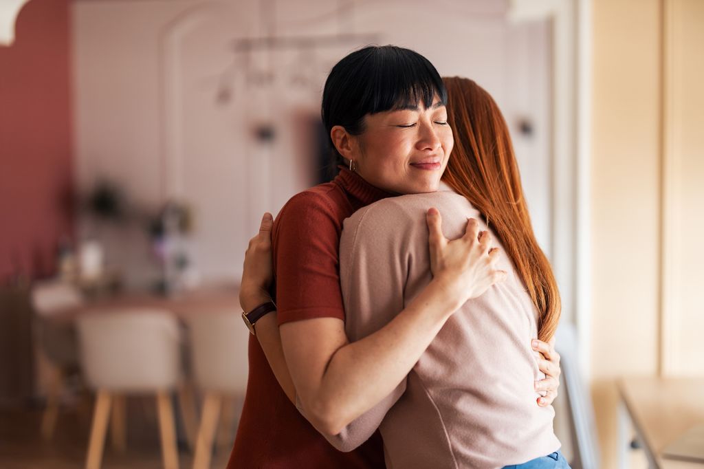 woman hugging being kind