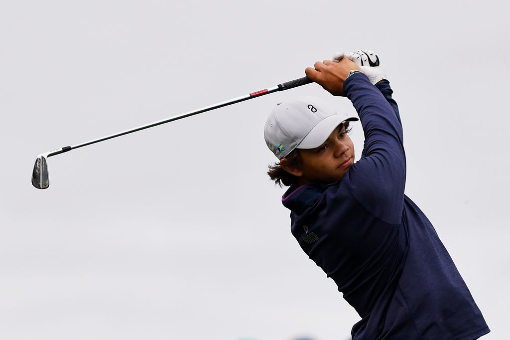 charlie woods hitting golf balls