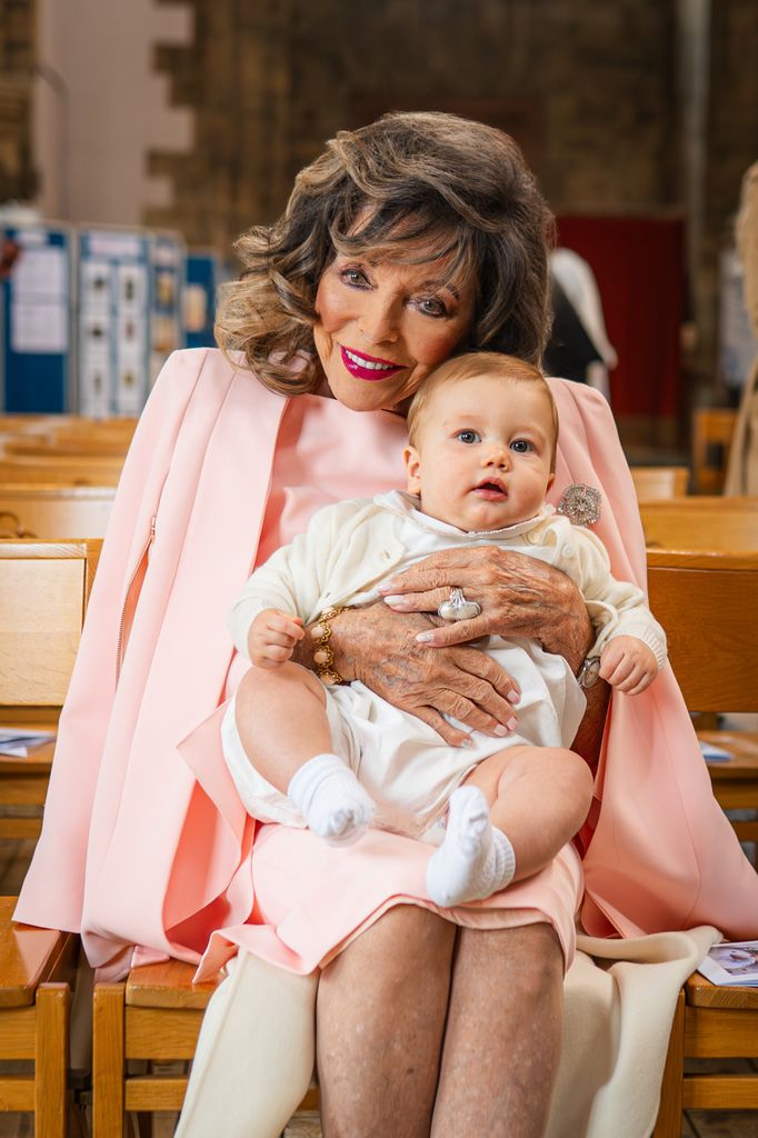 Joan Collins with baby Felix Peacock