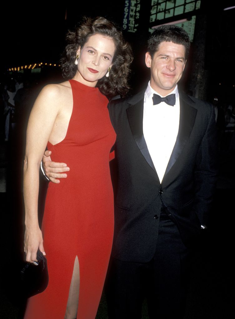 Sigourney Weaver and Jim Simpson red dress