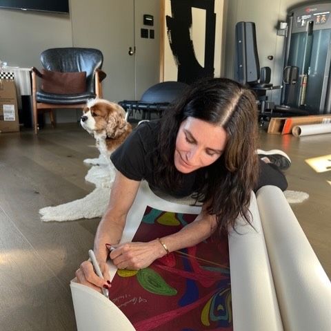 Courteney Cox signs limited edition artwork