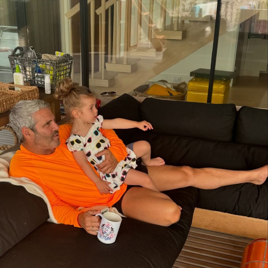 Andy and his daughter relaxing at home