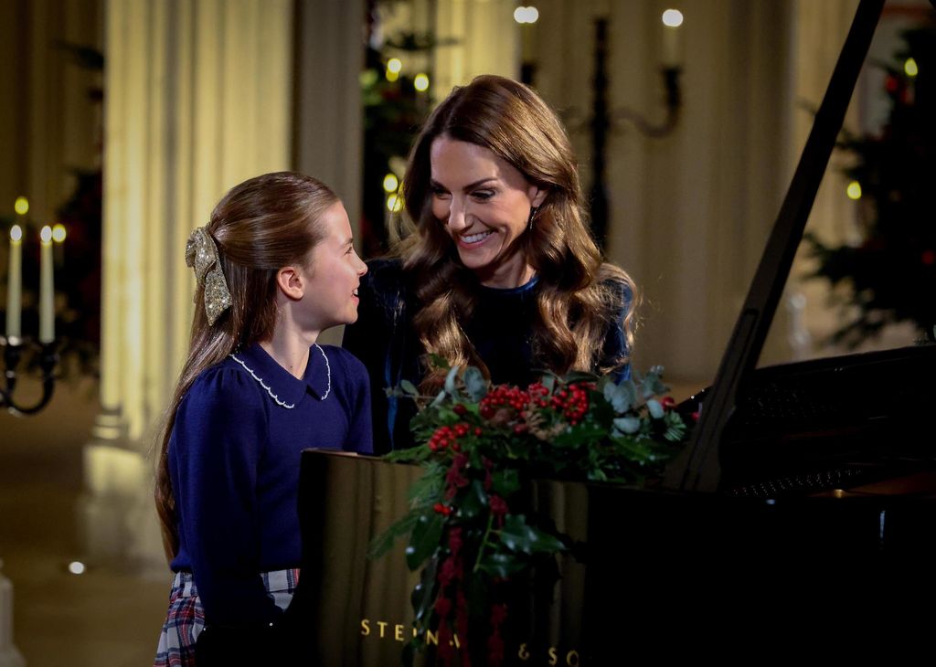 Princess Charlotte and Kate Middleton playing the piano