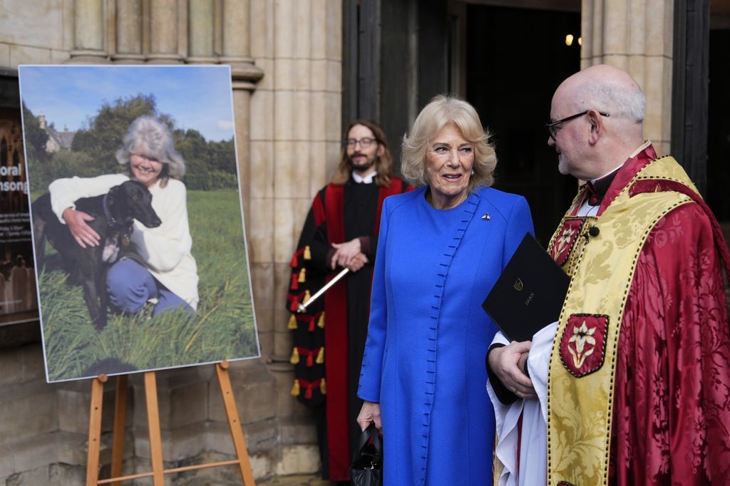 Queen Camilla speaks with Dean of Southwark Mark Oakley ahead of a service of thanksgiving for Dame Jilly Cooper at Southwark Cathedral, London