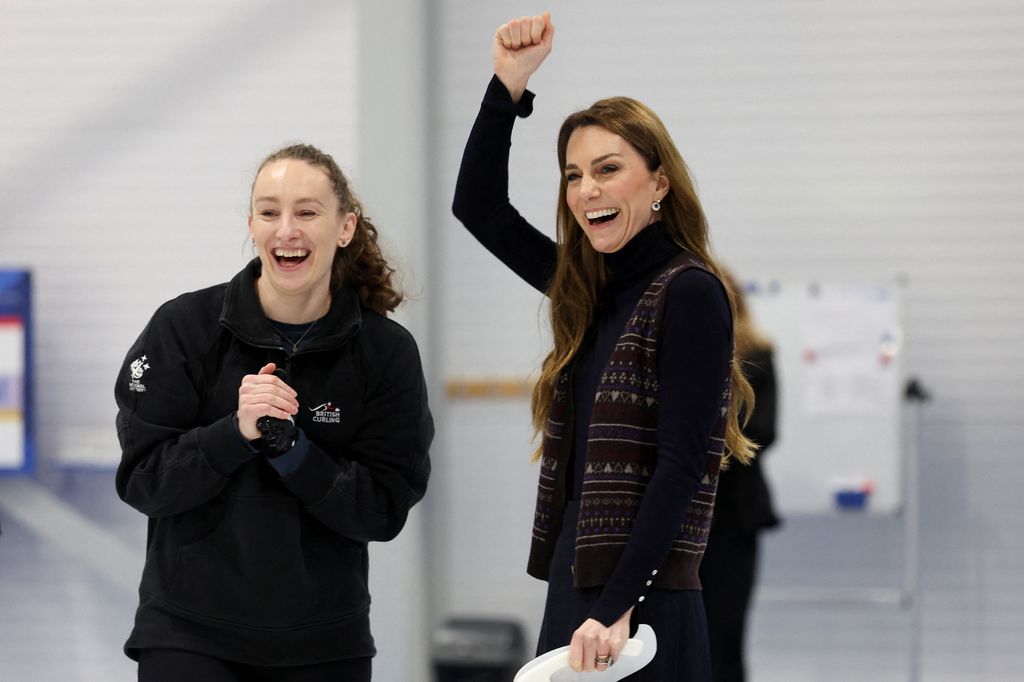 Kate punches the air in celebration after curling attempt