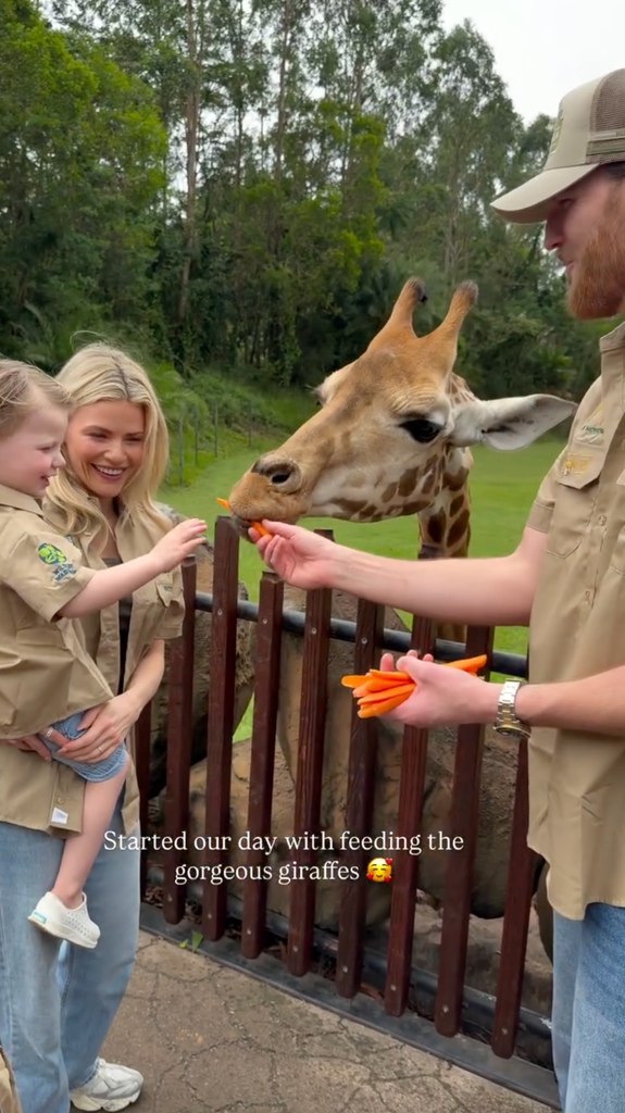witney carson family feeding giraffes