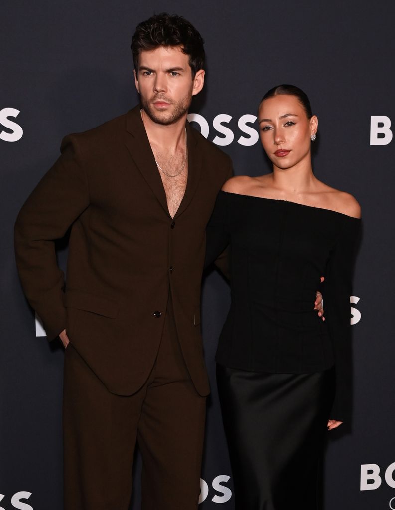 LONDON, ENGLAND - JANUARY 30: Luke Newton (L) and Antonia Roumelioti attend the BOSS One Premiere Party hosted by David Beckham at Lightroom on January 30, 2025 in London, England. (Photo by Alan Chapman/Dave Benett/Getty Images)