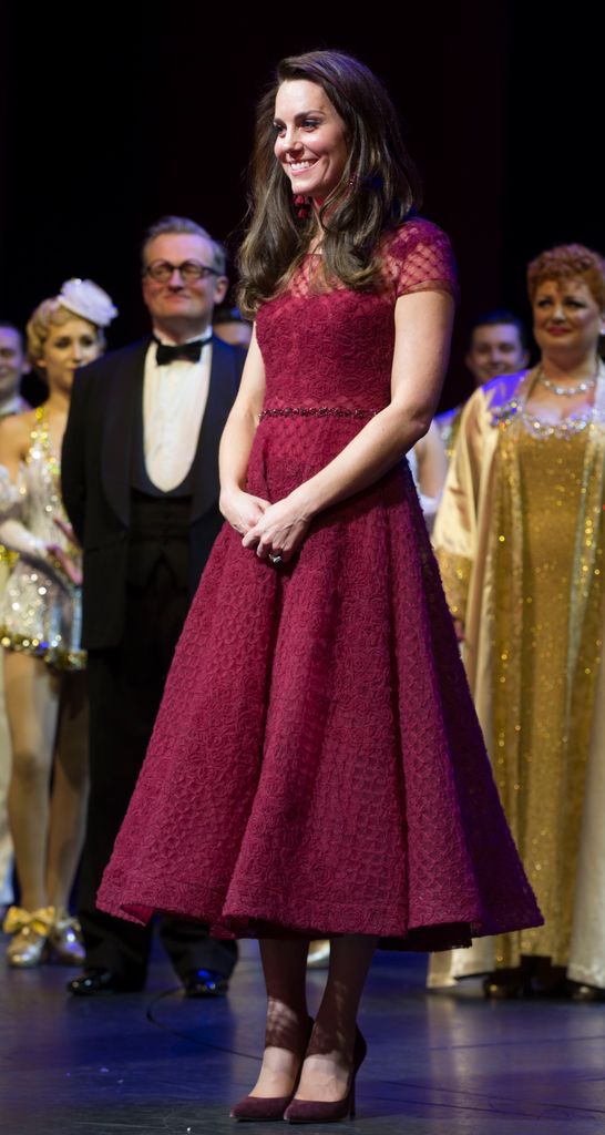 kate on stage in red dress