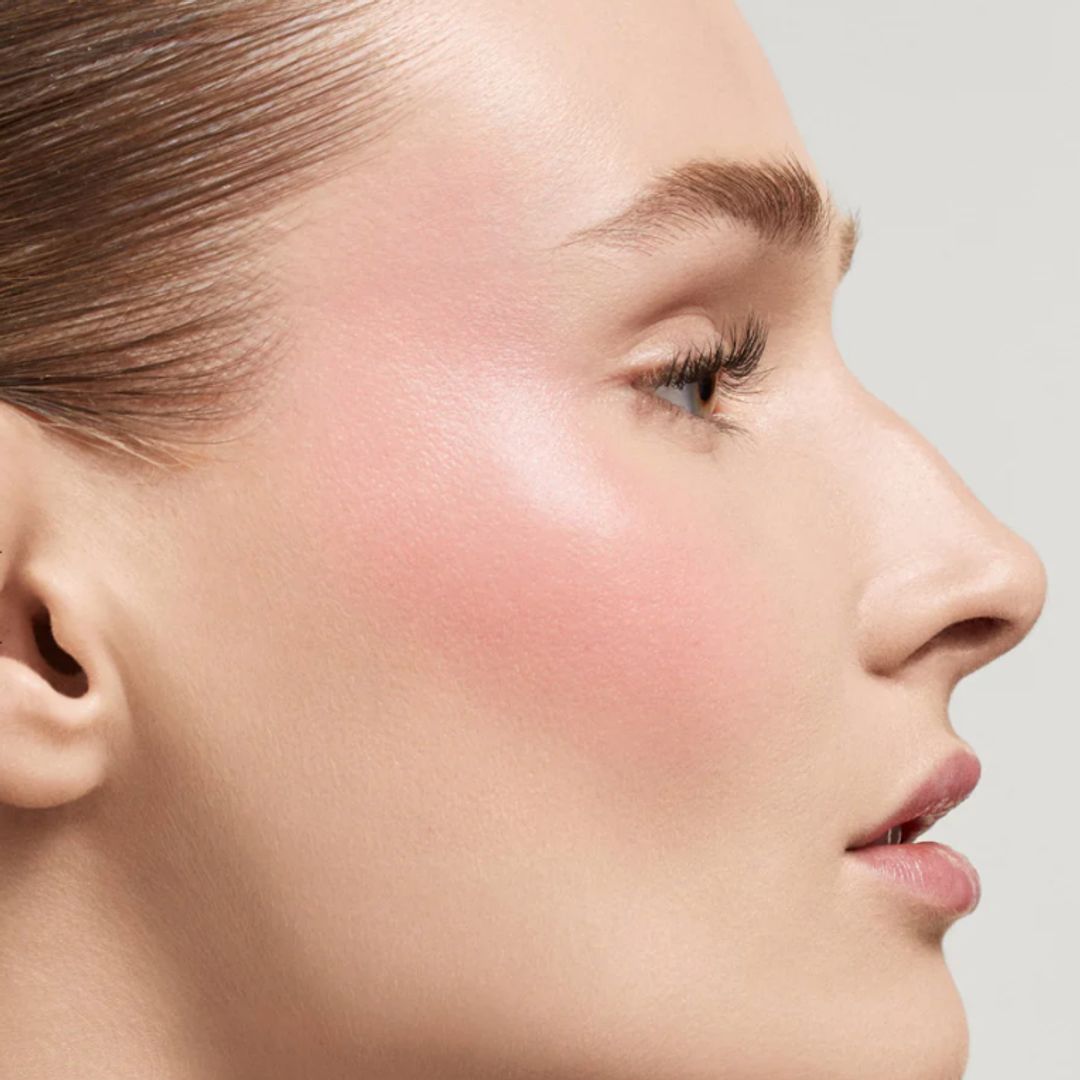 a woman showing off her pink rosy cheeks