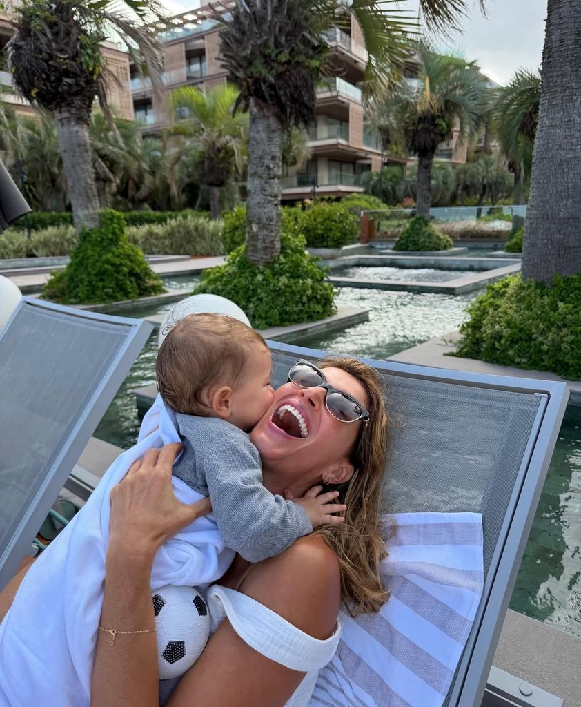 gisele bundchen hugging baby