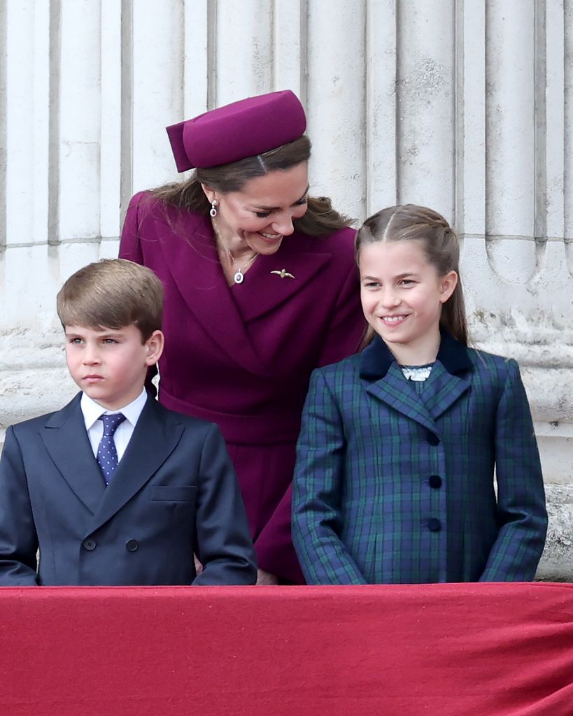 princess kate leaning down to talk to charlotte and louis