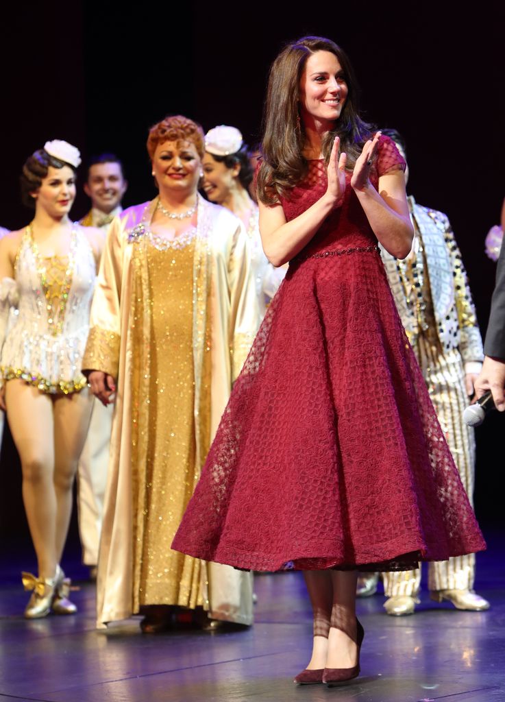 Kate on stage at 42nd street musical in red dress