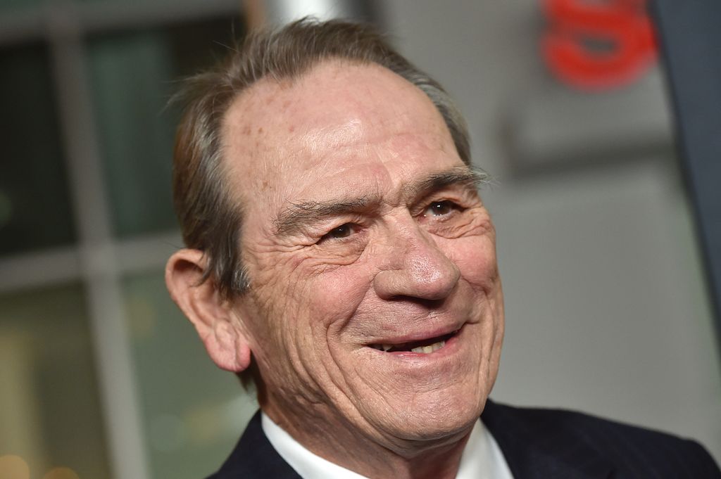 Actor Tommy Lee Jones in suit on red carpet