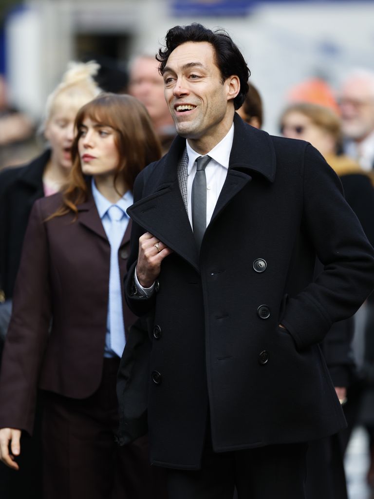 Bella Mclean and Alex Hassell attend the memorial service for Dame Jilly Cooper